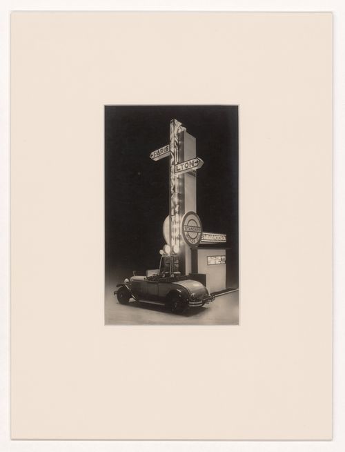 View of a car at a gas station, with signs pointing to Paris and Lyon, Salon d'automne, Paris, France