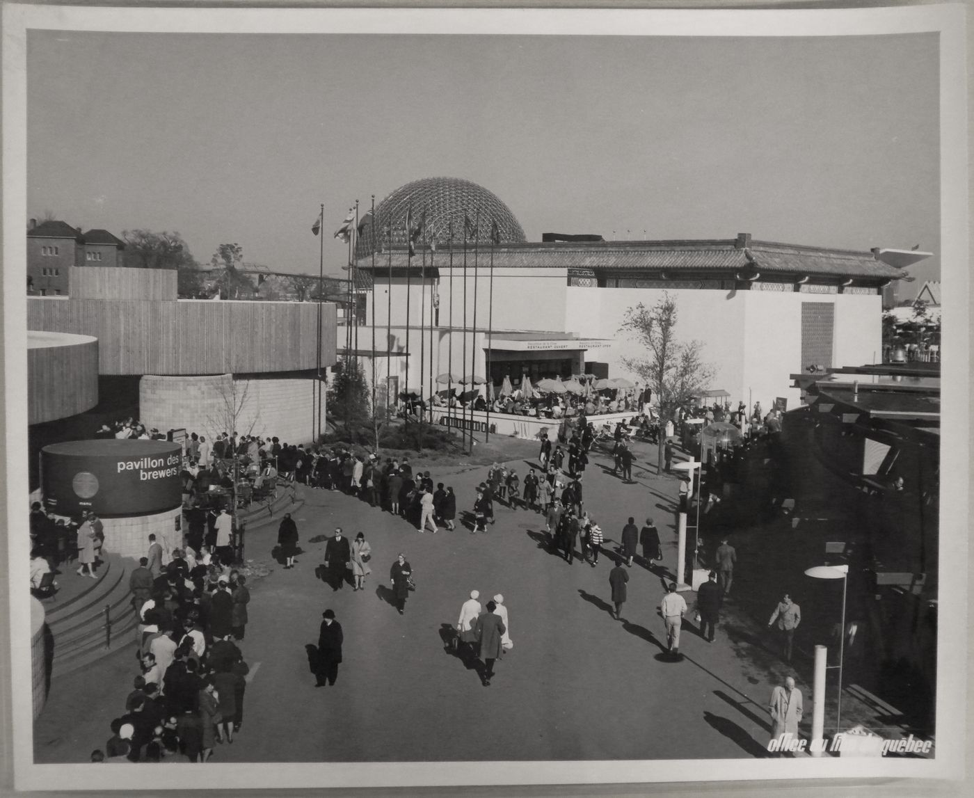 View of the Brewers and Chinese Pavilions with visitors standing in line, Expo 67, Montréal, Québec