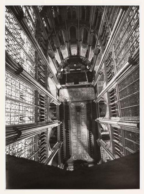 View from unusually elevated viewpoint in cathedral, looking down on alter, mosaic pavements, and choir stalls