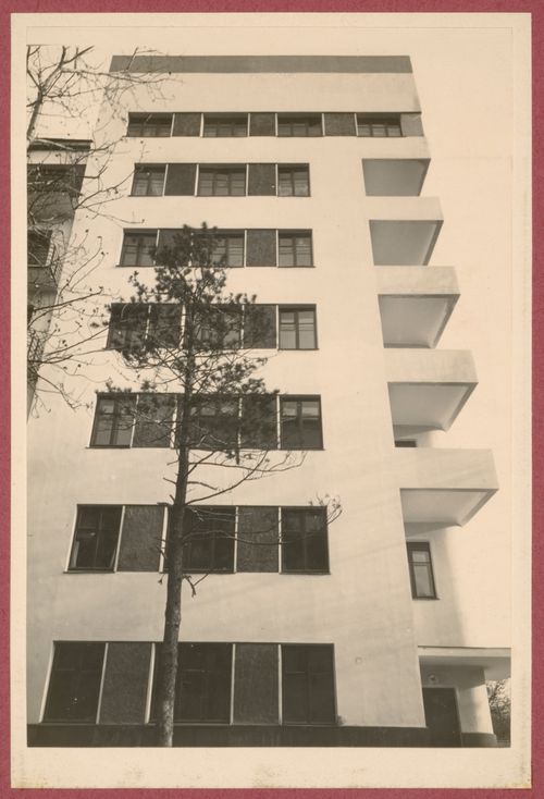 Partial exterior view of the Dukstroi Apartment Building showing windows and balconies from below, 34 Leningradskoe Shosse, Moscow