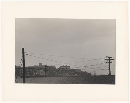 Telegraph poles and roof in foreground with buildings in distance (No. 9), Staten Island, New York City, New York