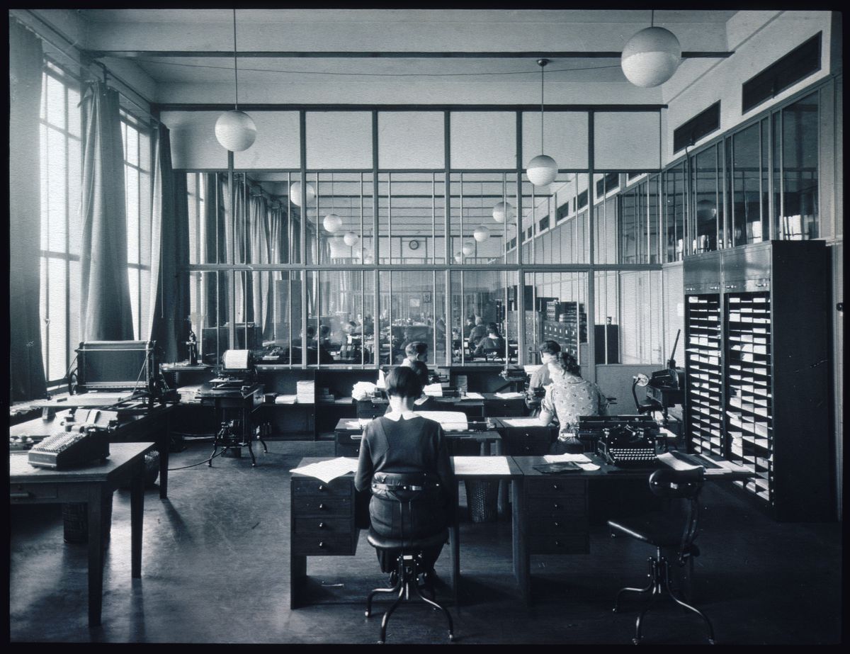 View of the interior of an office with glass partitions