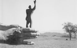 Le Corbusier's hand holding the silhouette of the Modulor while sighting the Chandigarh plain and the Siwalik mountain range
